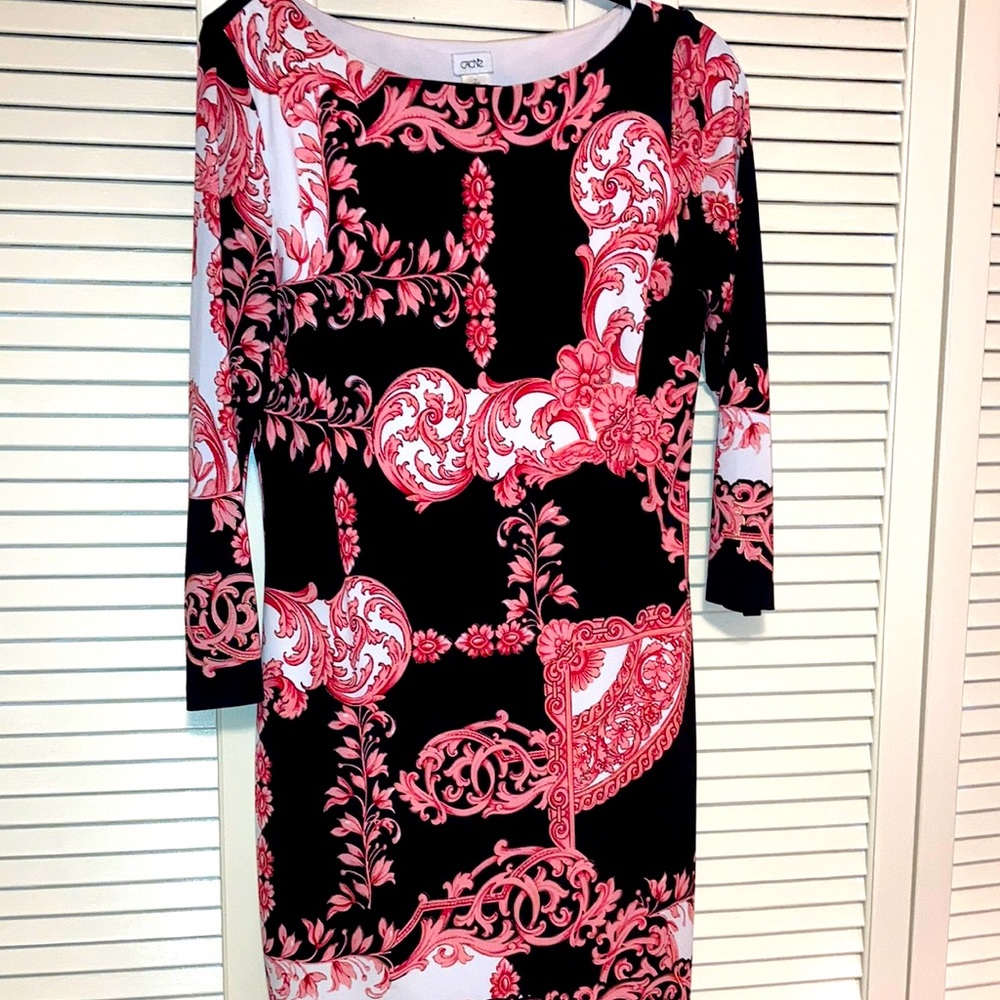 Cache, size large. Black, pink, white and touches of gold.